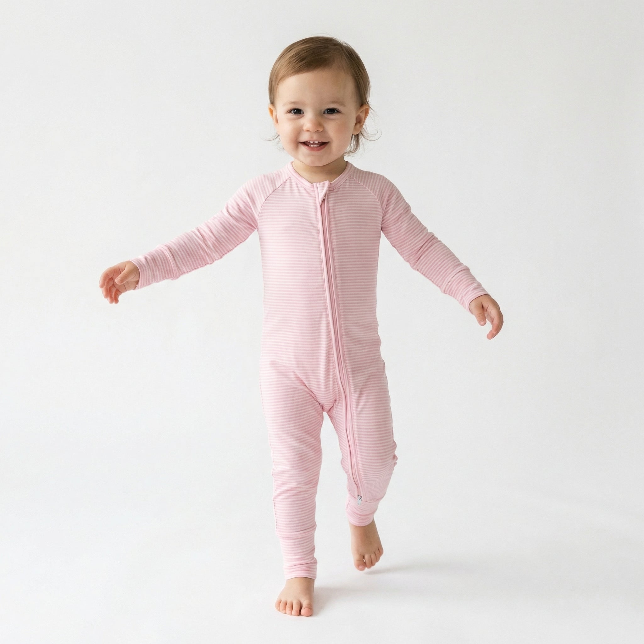 Top ranked breathable bamboo baby sleeper in pink and white stripe loved by parents of newborns with sensitive skin