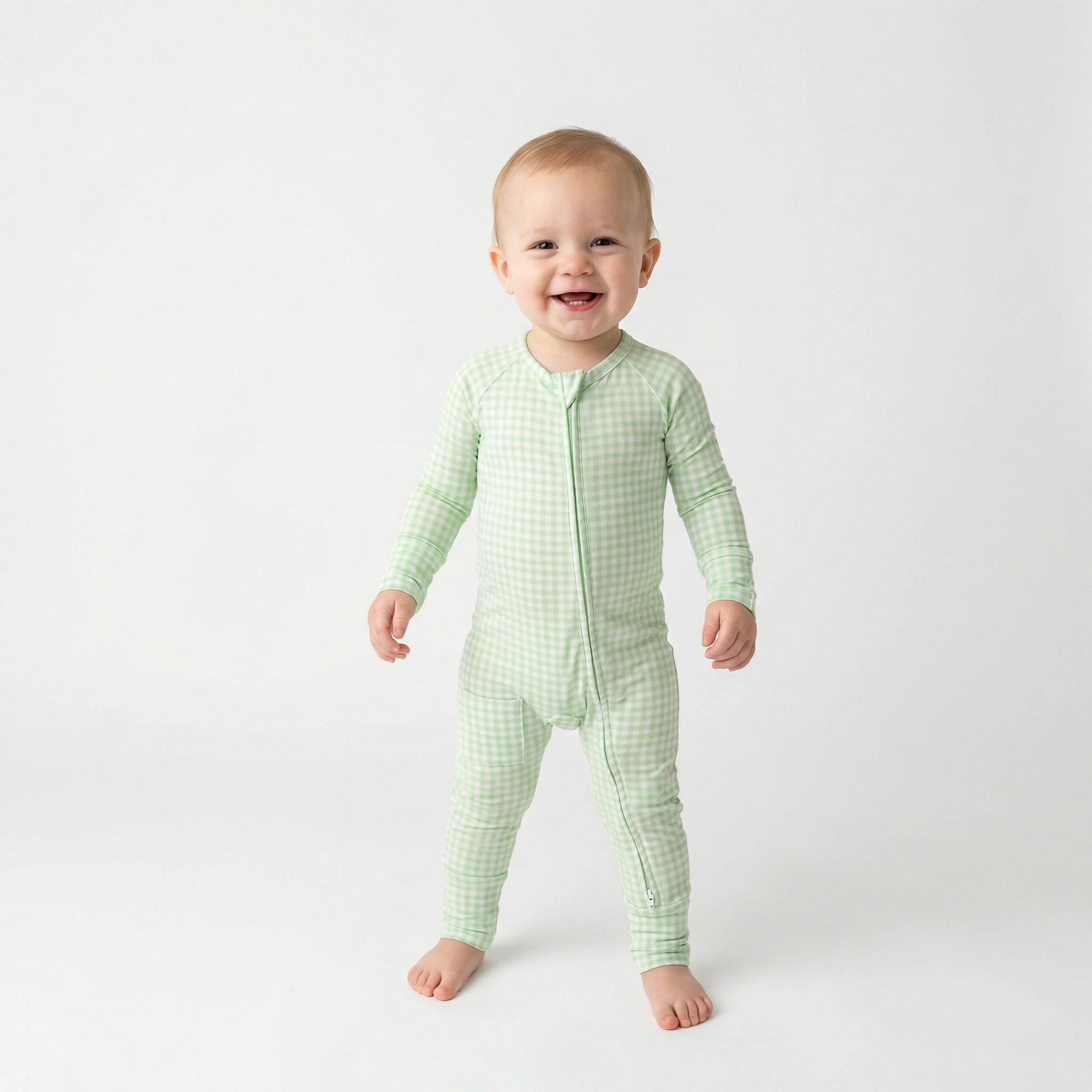 Editor favorite Motette organic bamboo baby sleeper in green gingham designed for everyday comfort