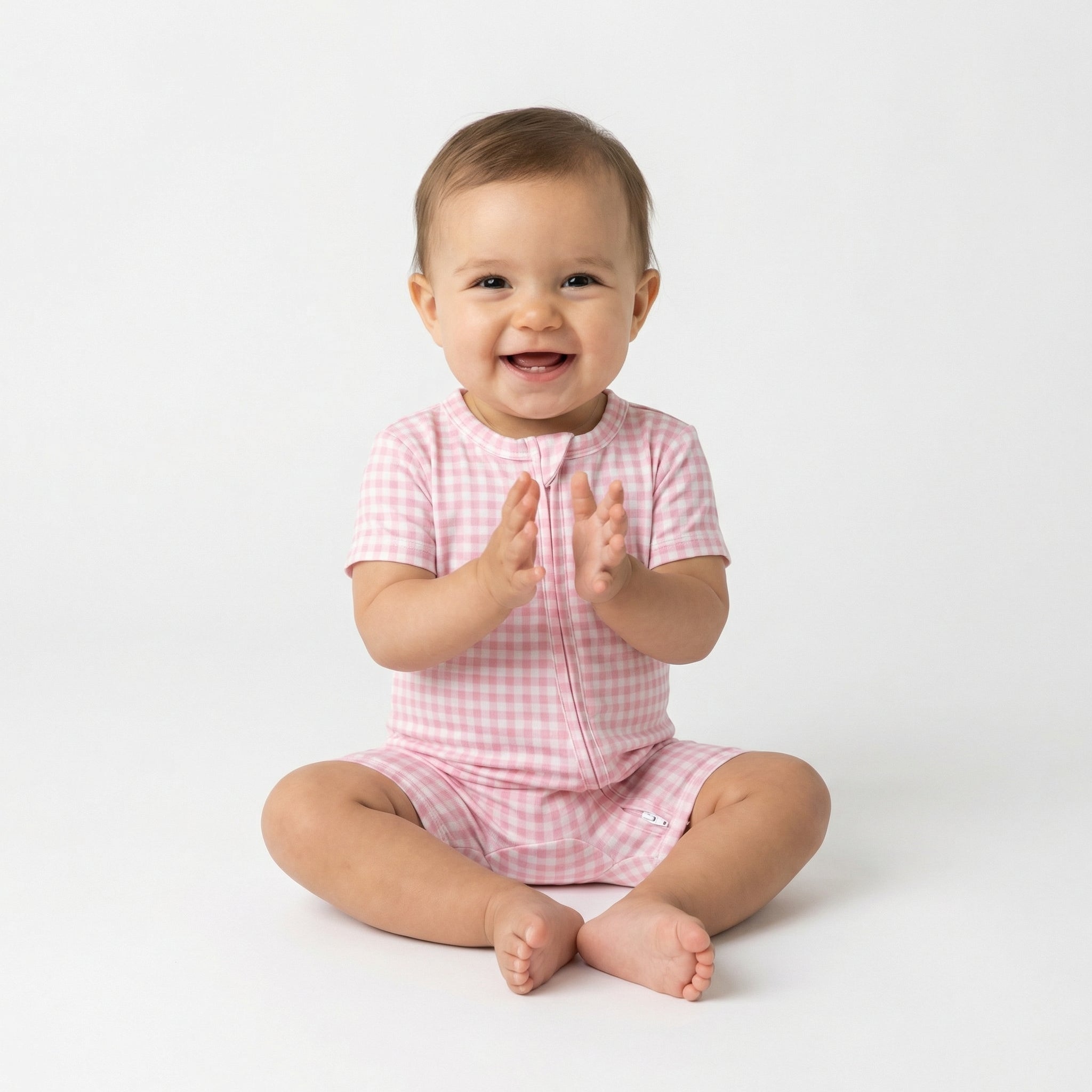 Editor favorite Motette organic bamboo baby sleeper in pink gingham designed for everyday comfort