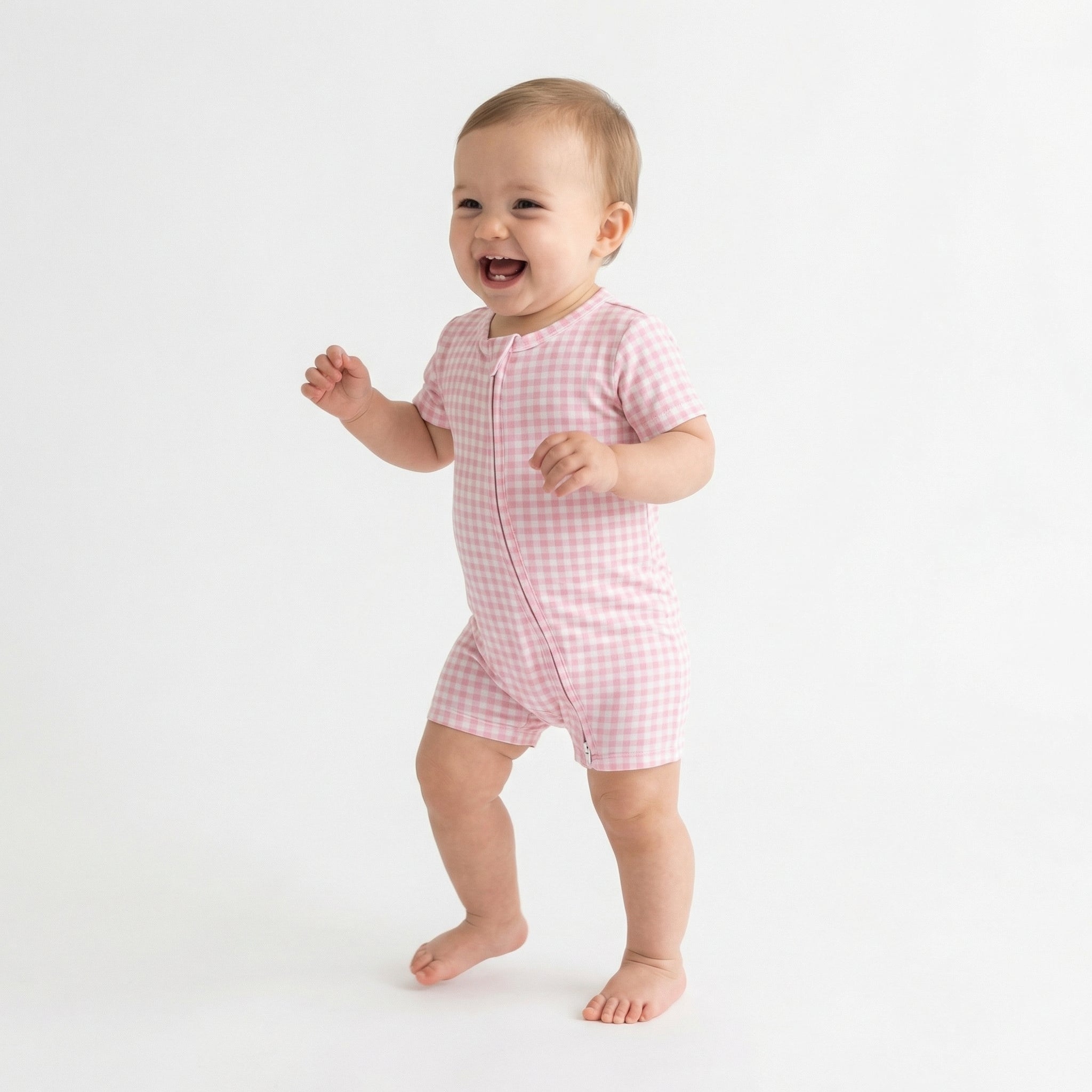 Top ranked breathable bamboo baby sleeper in pink gingham loved by parents of newborns with sensitive skin
