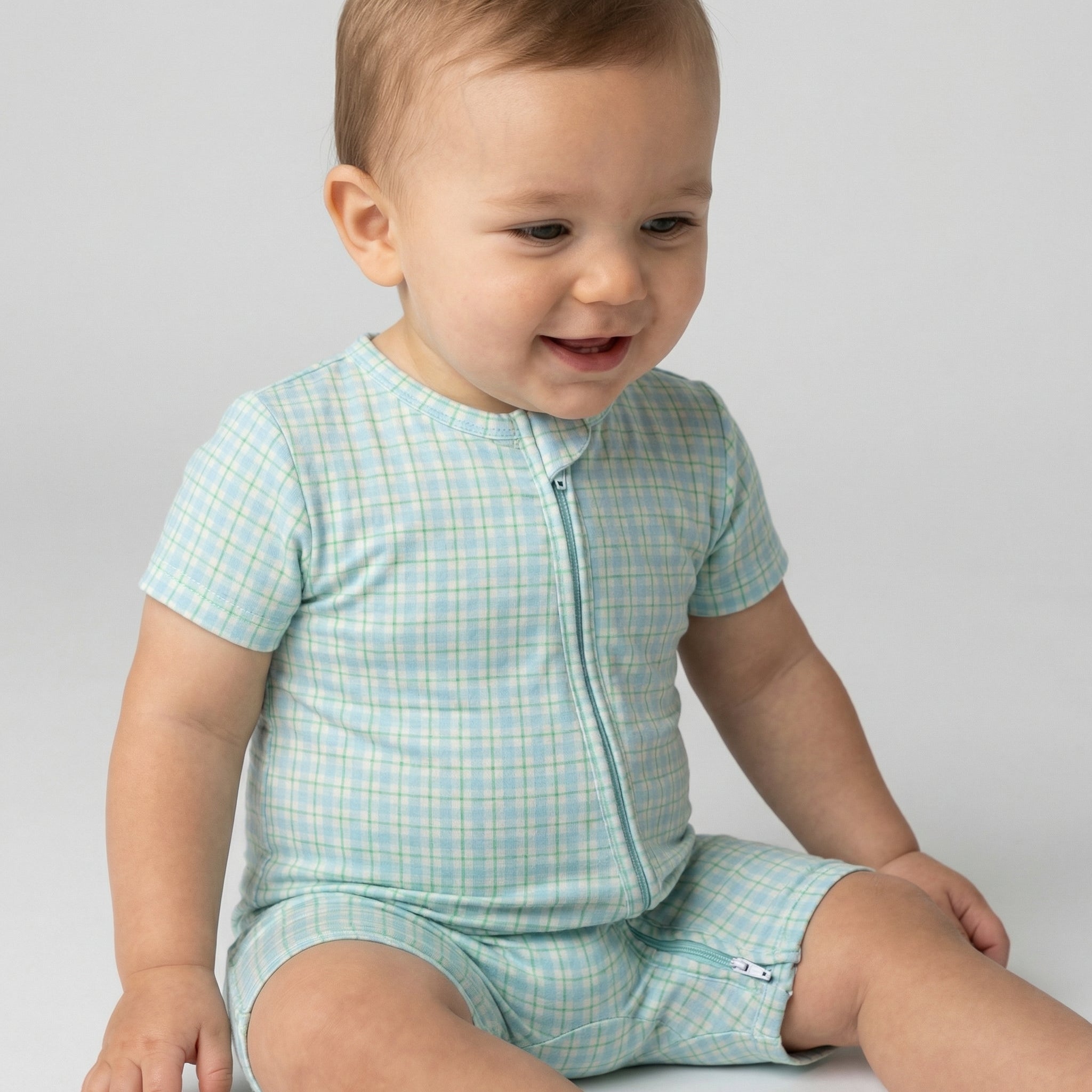 Best lightweight baby sleeper in blue and green gingham for year round use recommended by modern parents