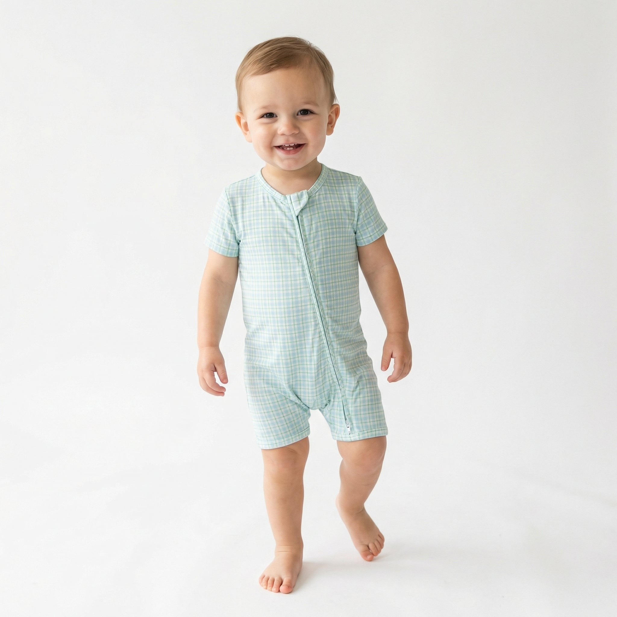 Top ranked breathable bamboo baby sleeper in blue and green gingham loved by parents of newborns with sensitive skin
