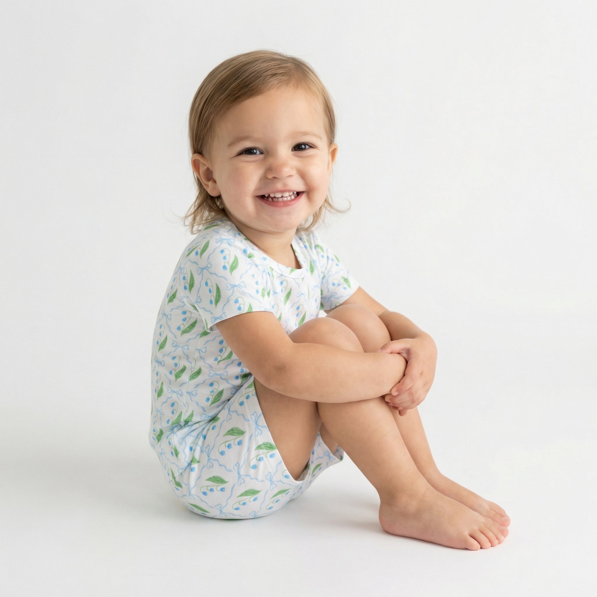 Consumer favorite Motette kids pajama set in white with green leaves for bedtime routines
