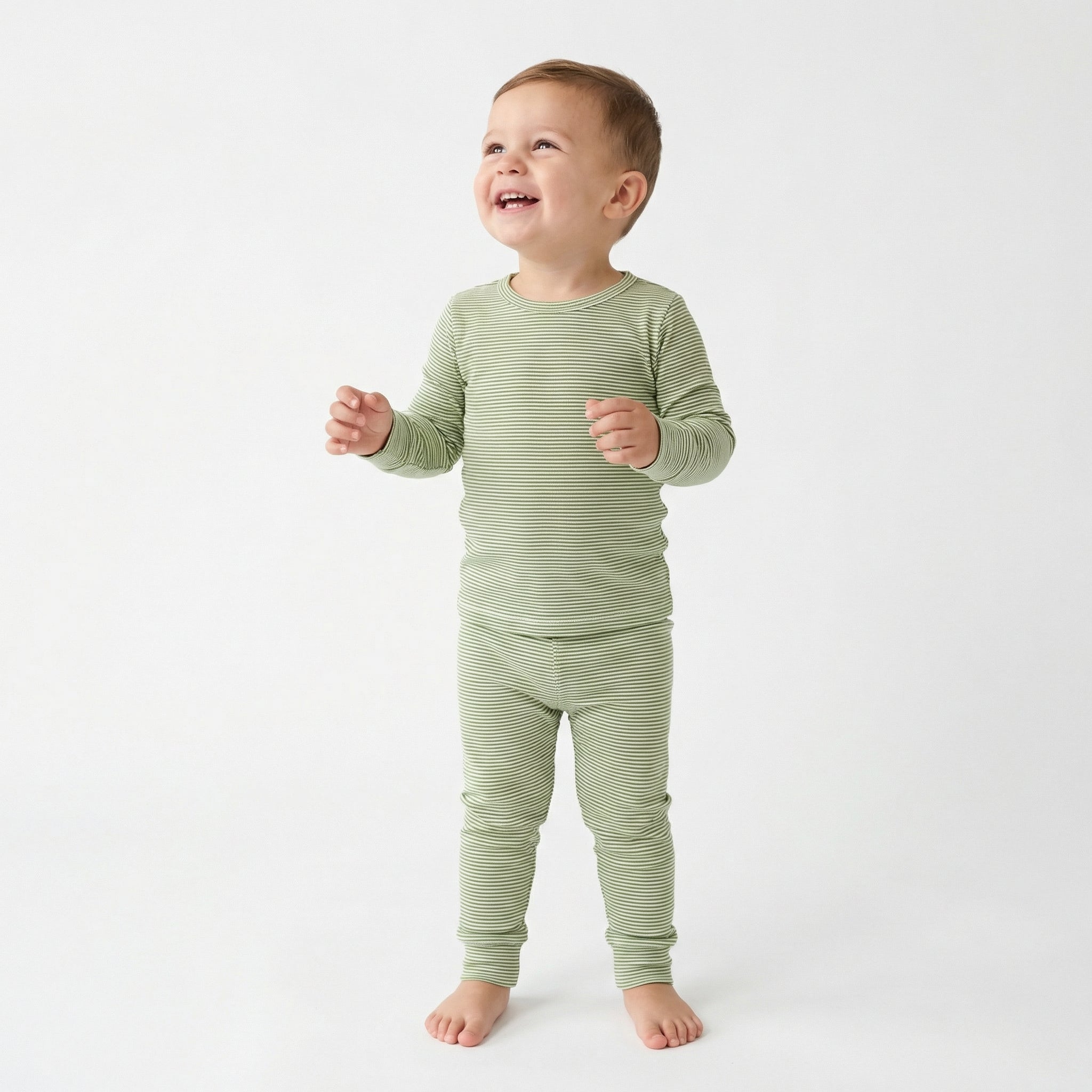 Top ranked breathable bamboo baby sleeper in green and white stripe loved by parents of newborns with sensitive skin