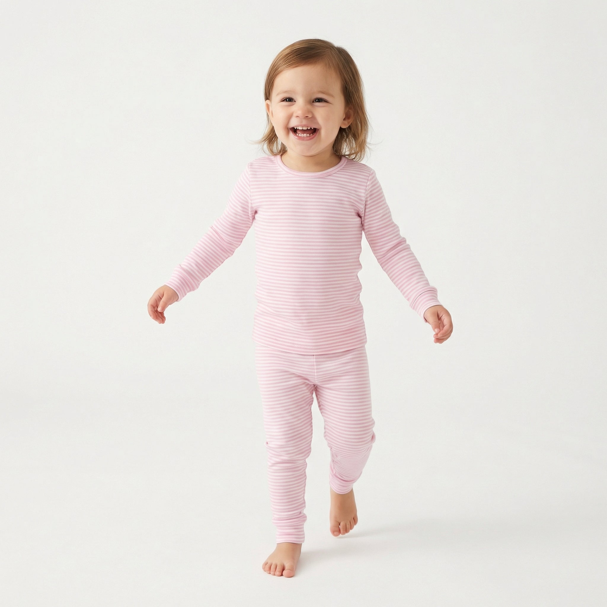 Parent approved Motette bamboo toddler pajamas in pink and white stripes for all season wear