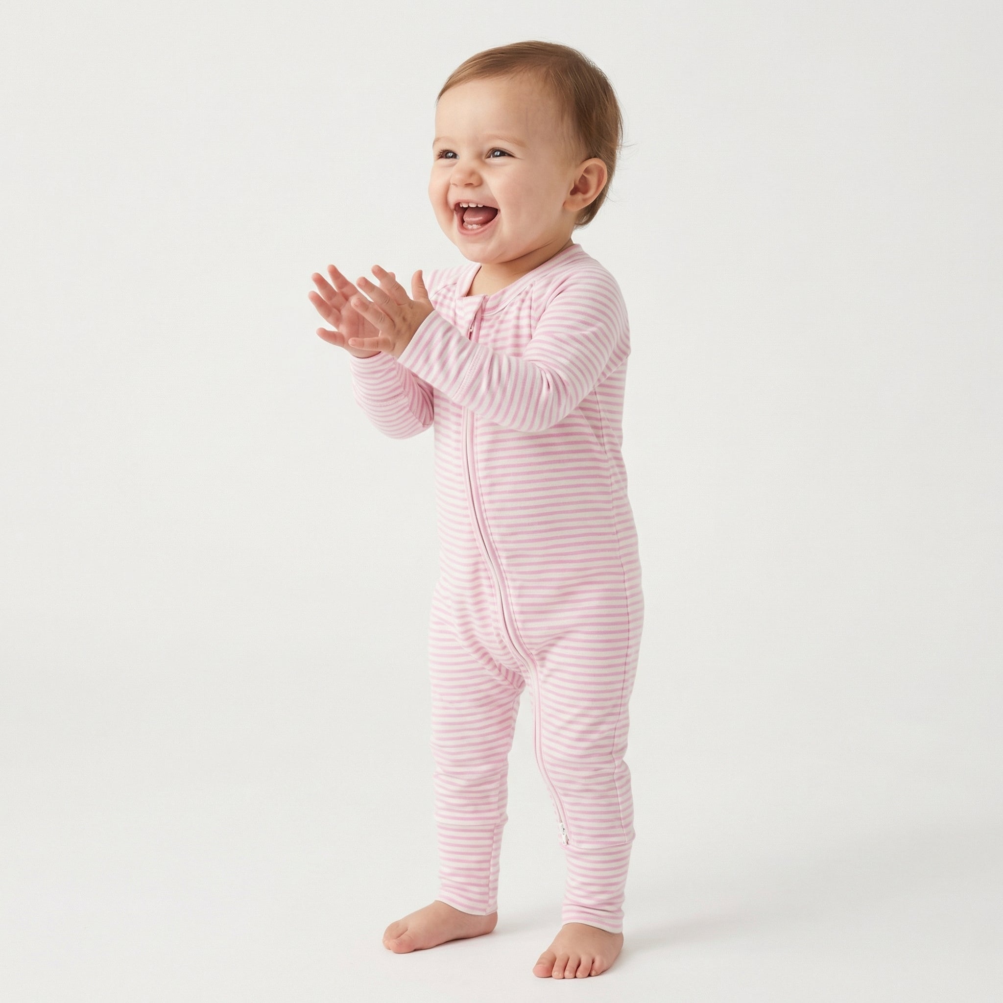 Top ranked breathable bamboo baby sleeper in pink and white stripe loved by parents of newborns with sensitive skin