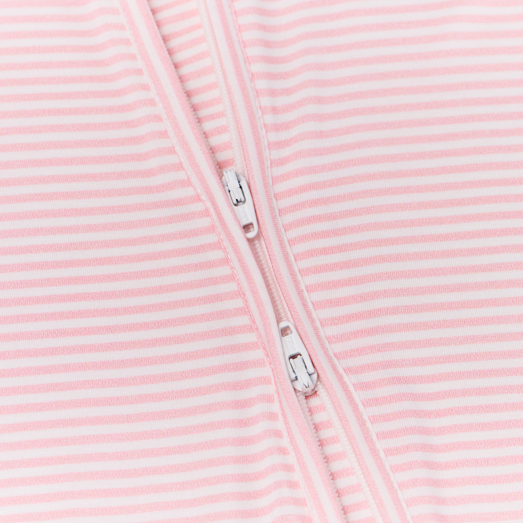 Close-up of the two-way zipper on the sleeper, showing easy-access functionality for changes