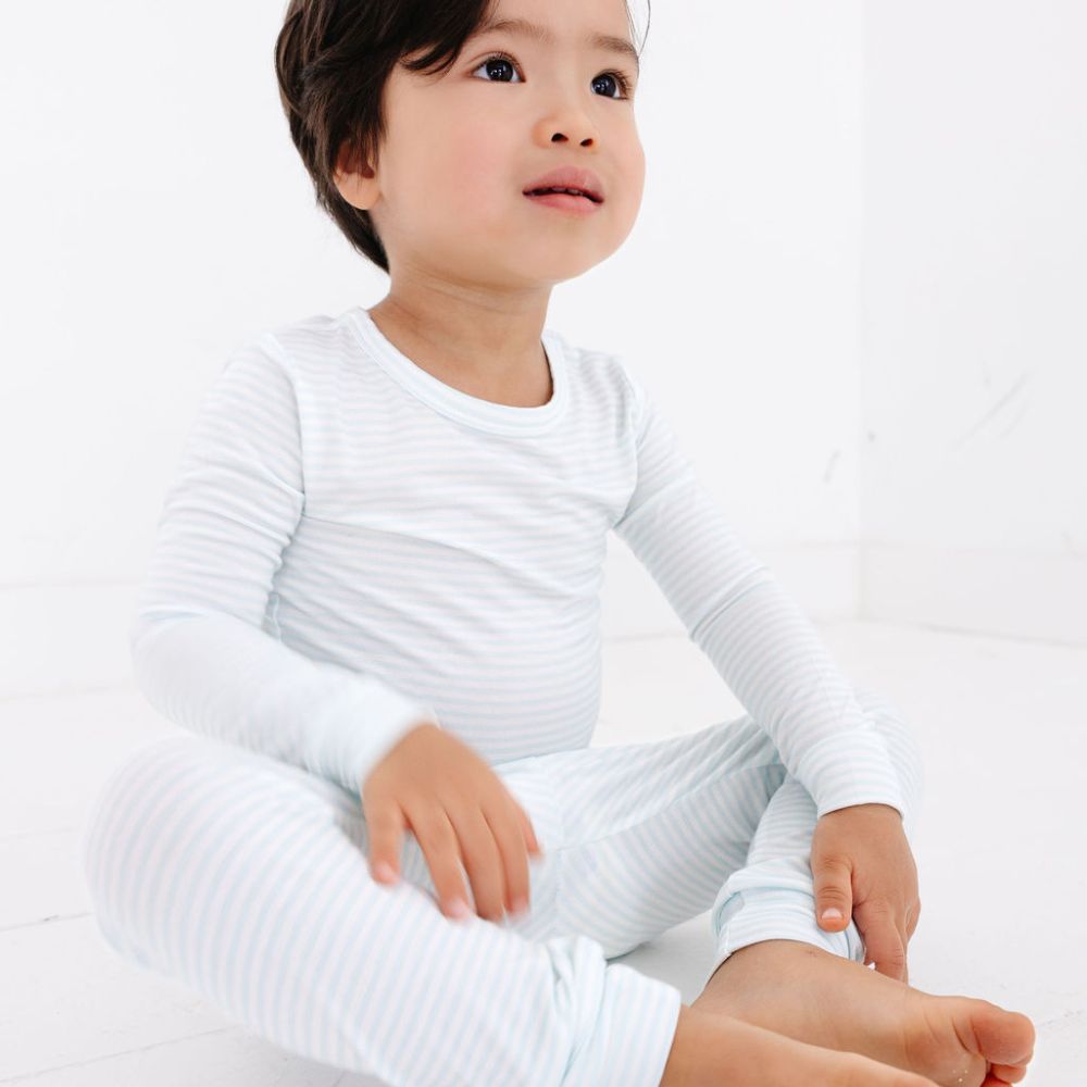 Close-up of toddler in Cloud Stripe bamboo pajamas by Motette – soft and top-ranked bamboo sleepwear