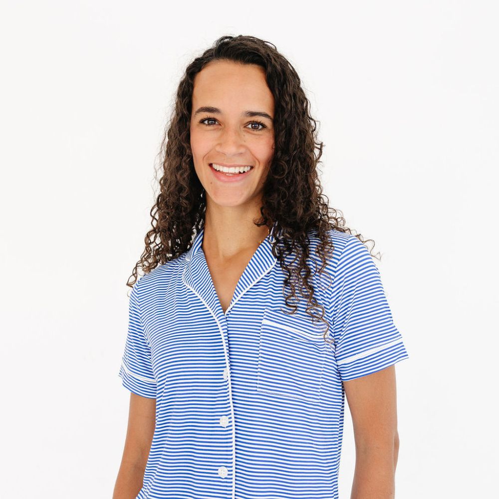 Close-up of smiling mom in cobalt stripe bamboo sleepwear – eczema friendly, soft and breathable
