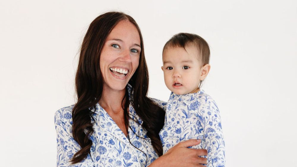 Mommy holding baby in matching porcelain vine bamboo pajama sets – eczema friendly and coordinated styles by Motette