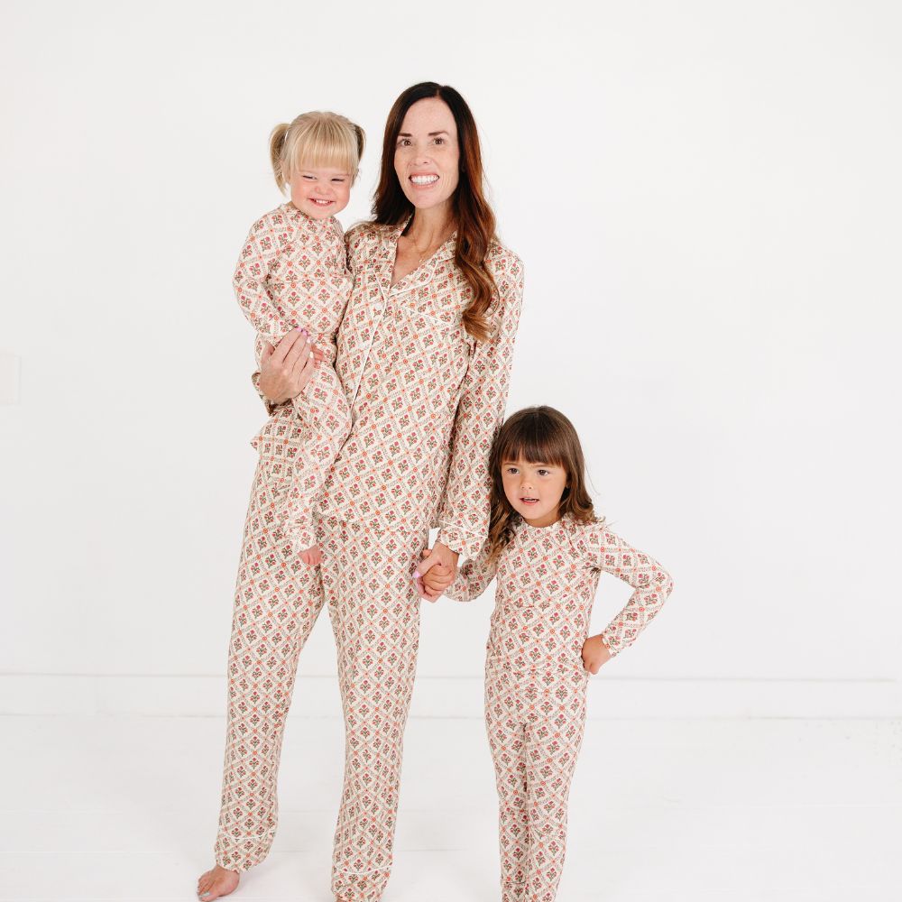 Mommy with two kids wearing matching Motette Holly Trellis Bamboo Pajamas and Baby Sleeper sets.