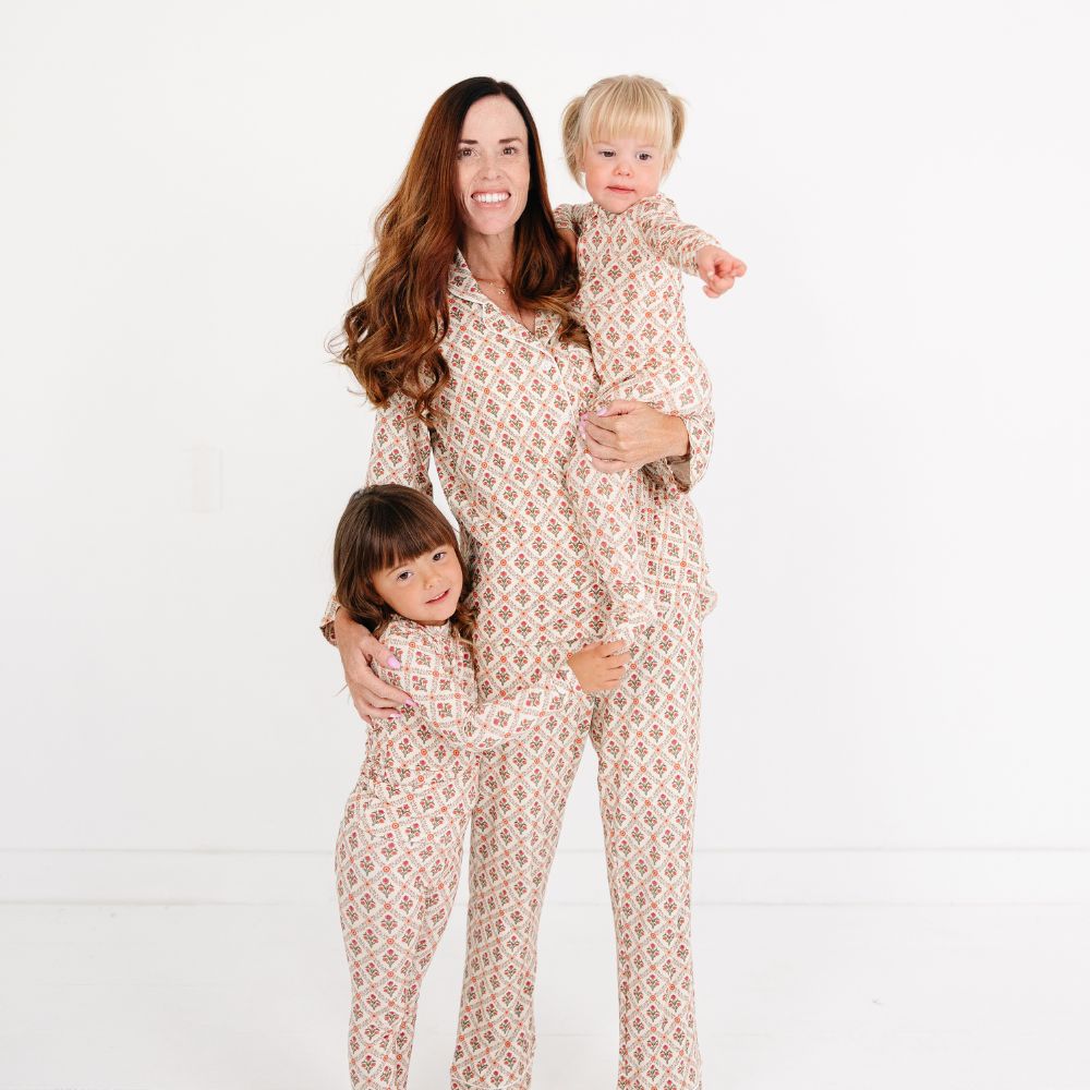 Mommy wearing matching Motette Holly Trellis Bamboo Pajamas holding baby in Motette Holly Trellis Bamboo Sleeper.