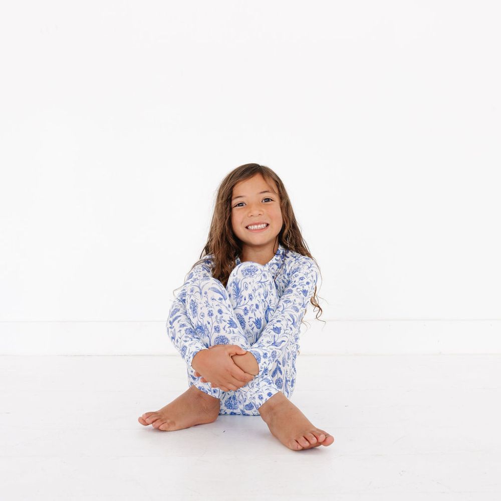 Toddler smiling while seated – Porcelain Vine – top-ranked bamboo pajamas for sensitive skin by Motette