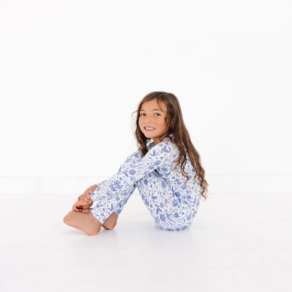 Toddler sitting sideways on floor – Porcelain Vine – eczema friendly bamboo pajamas by Motette