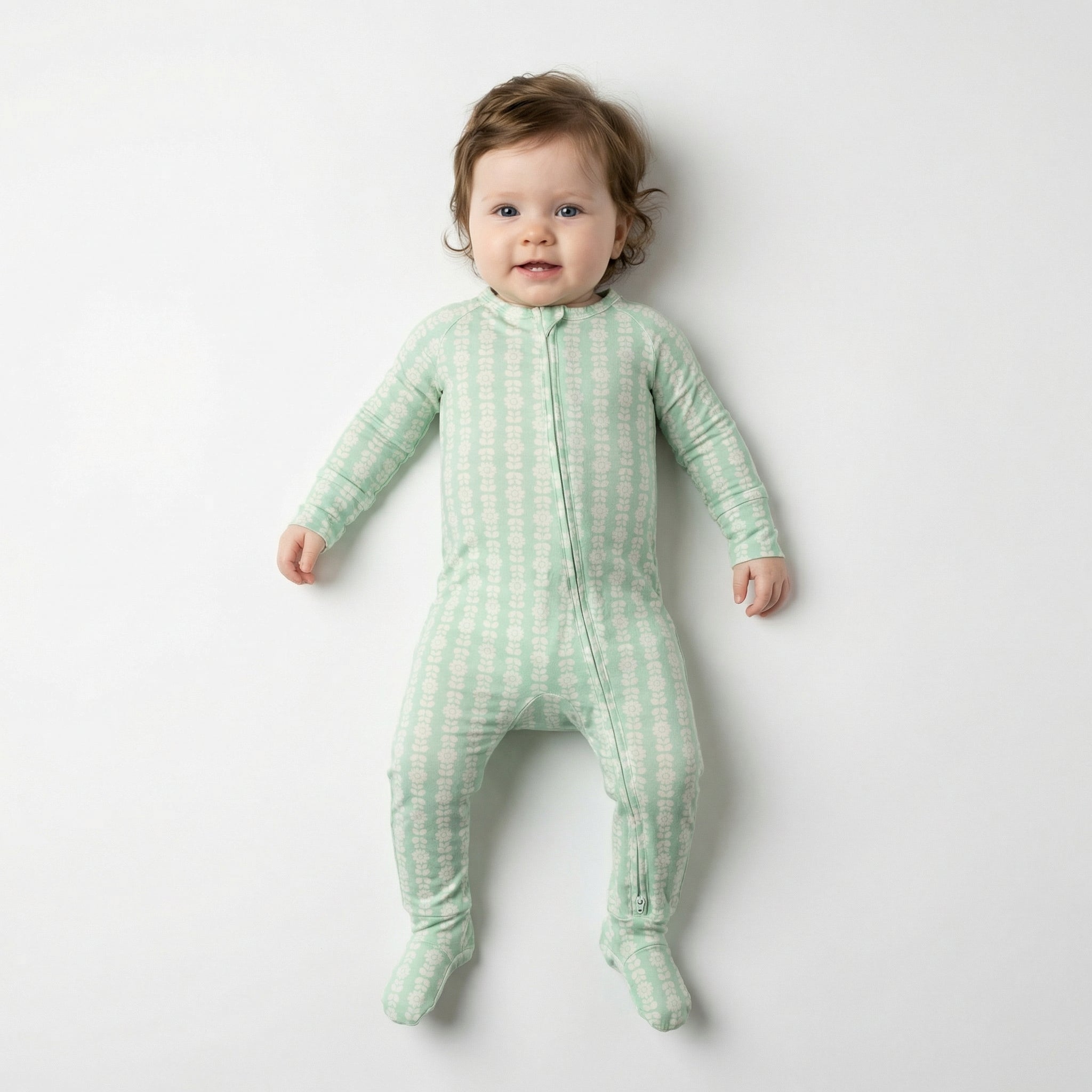 Editor favorite Motette organic bamboo baby sleeper in green with white floral designed for everyday comfort