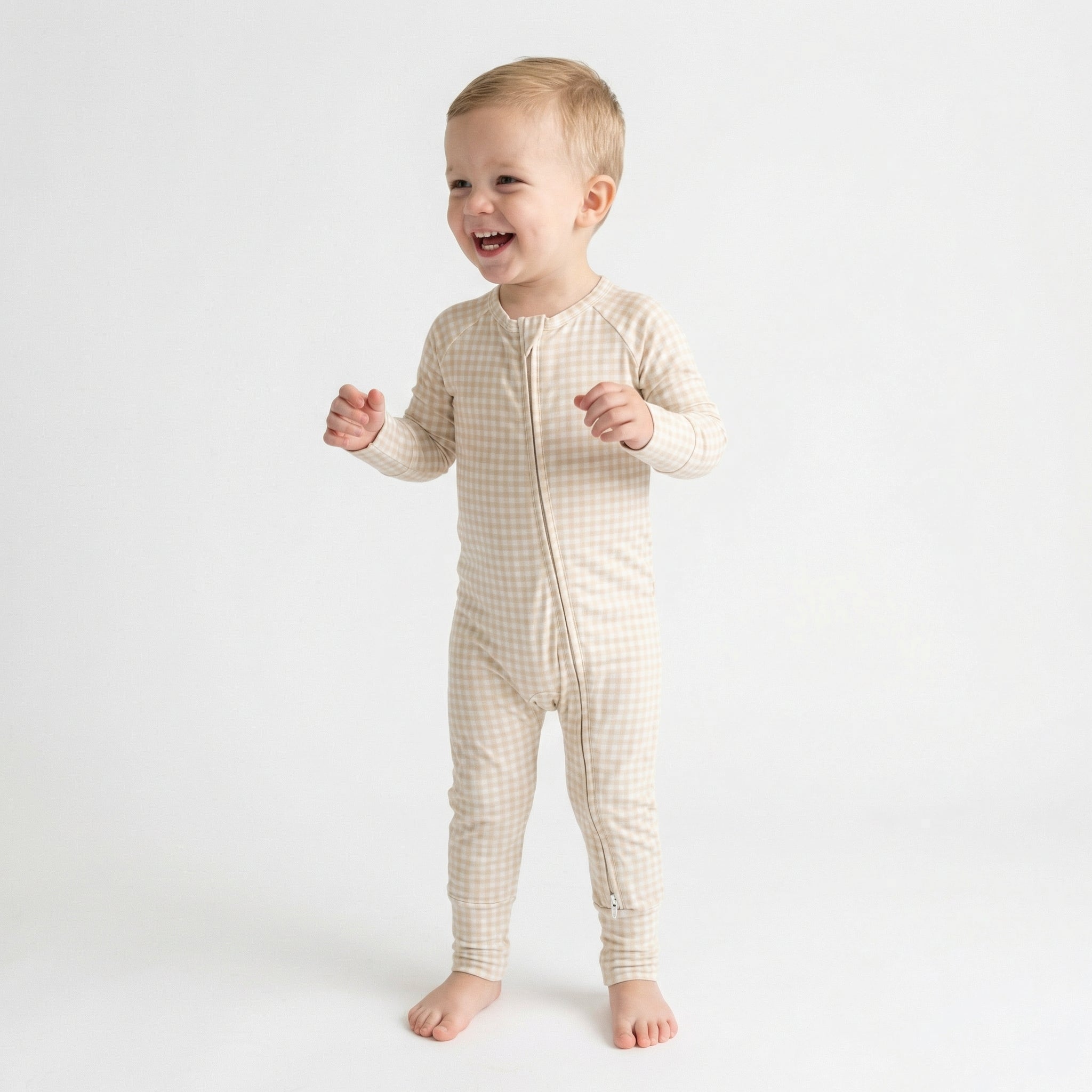 Top ranked breathable bamboo baby sleeper in brown gingham loved by parents of newborns with sensitive skin