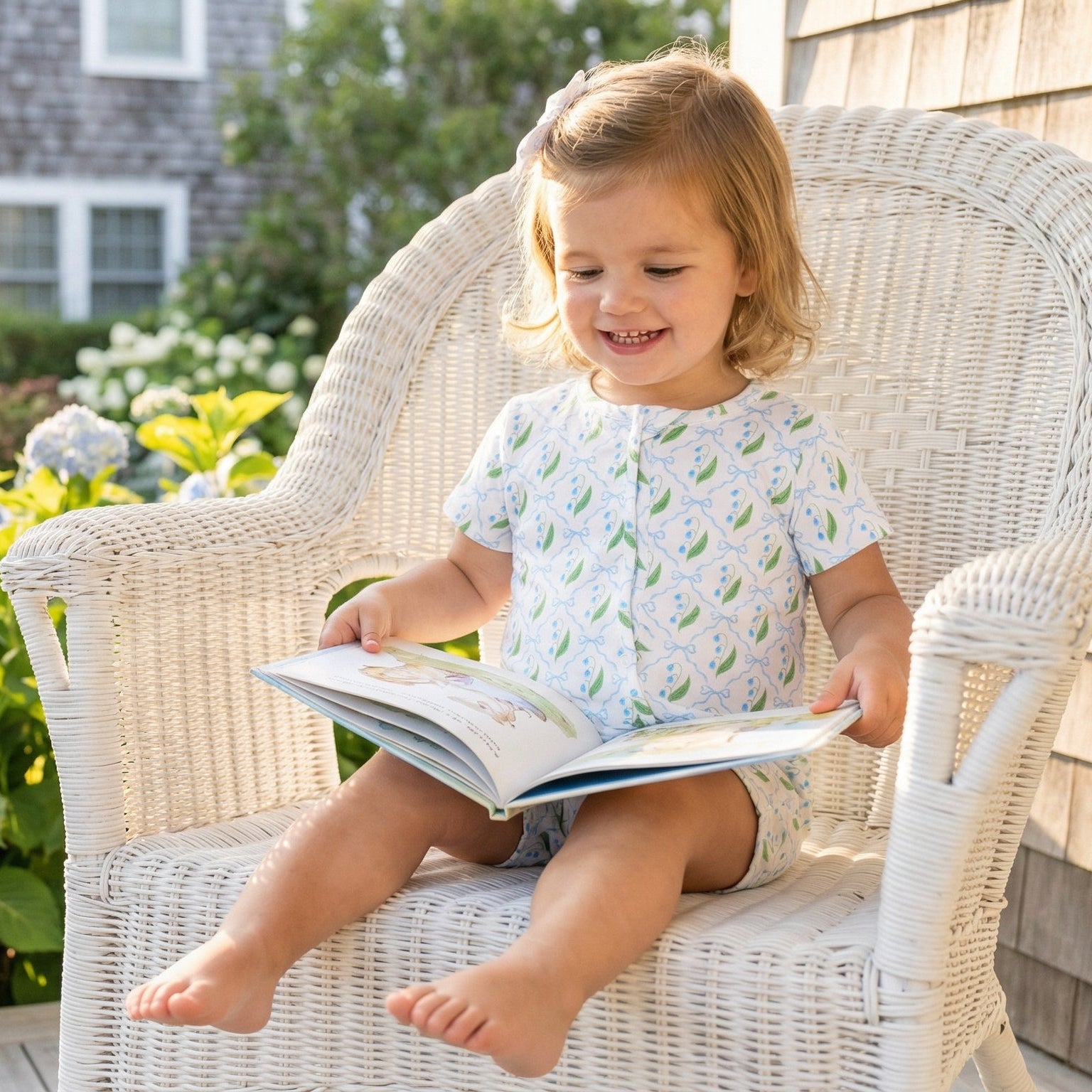 Top rated footed bamboo sleeper in white with green leaves trusted by moms for soft, comfortable sleep