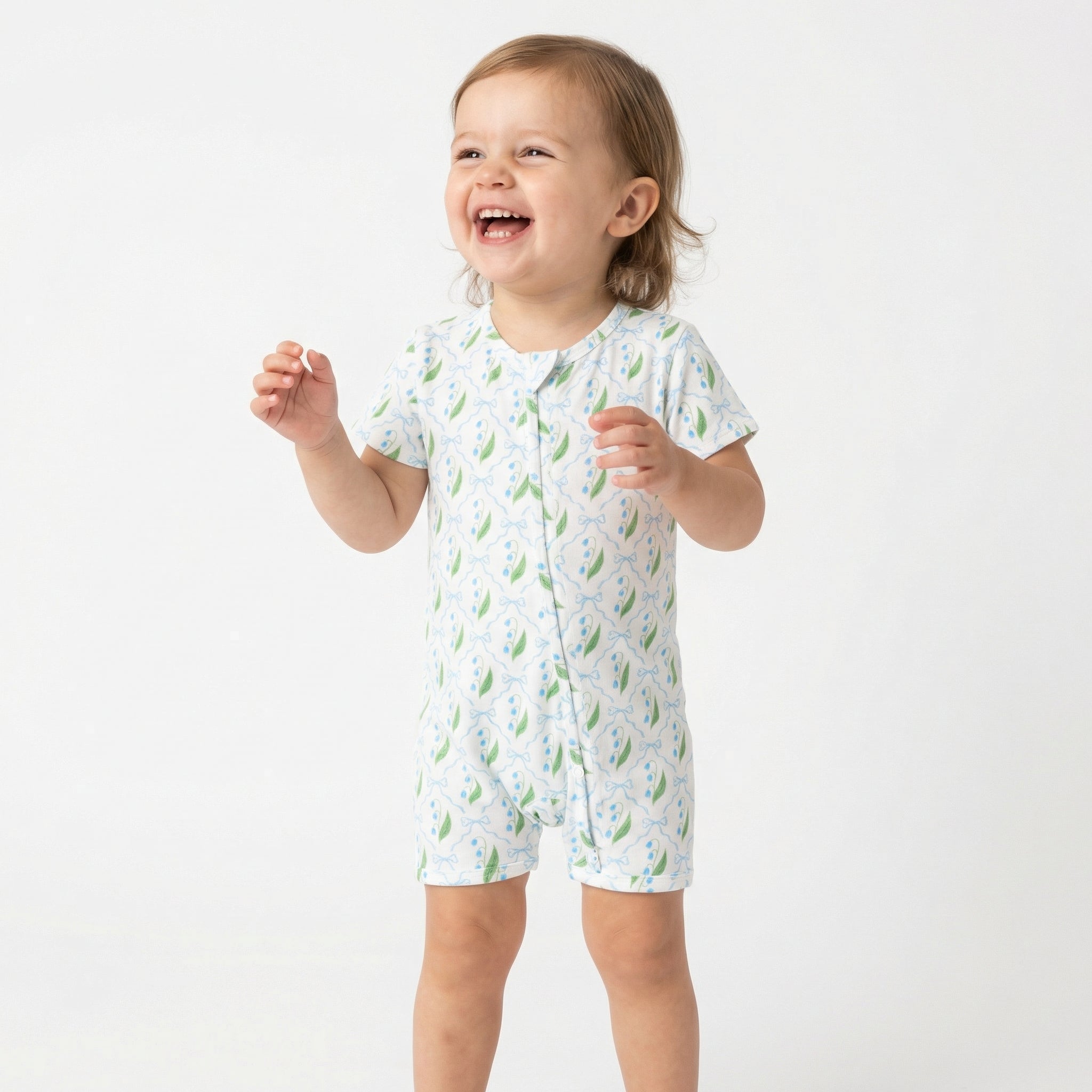 Top ranked breathable bamboo baby sleeper in white with green leaves loved by parents of newborns with sensitive skin