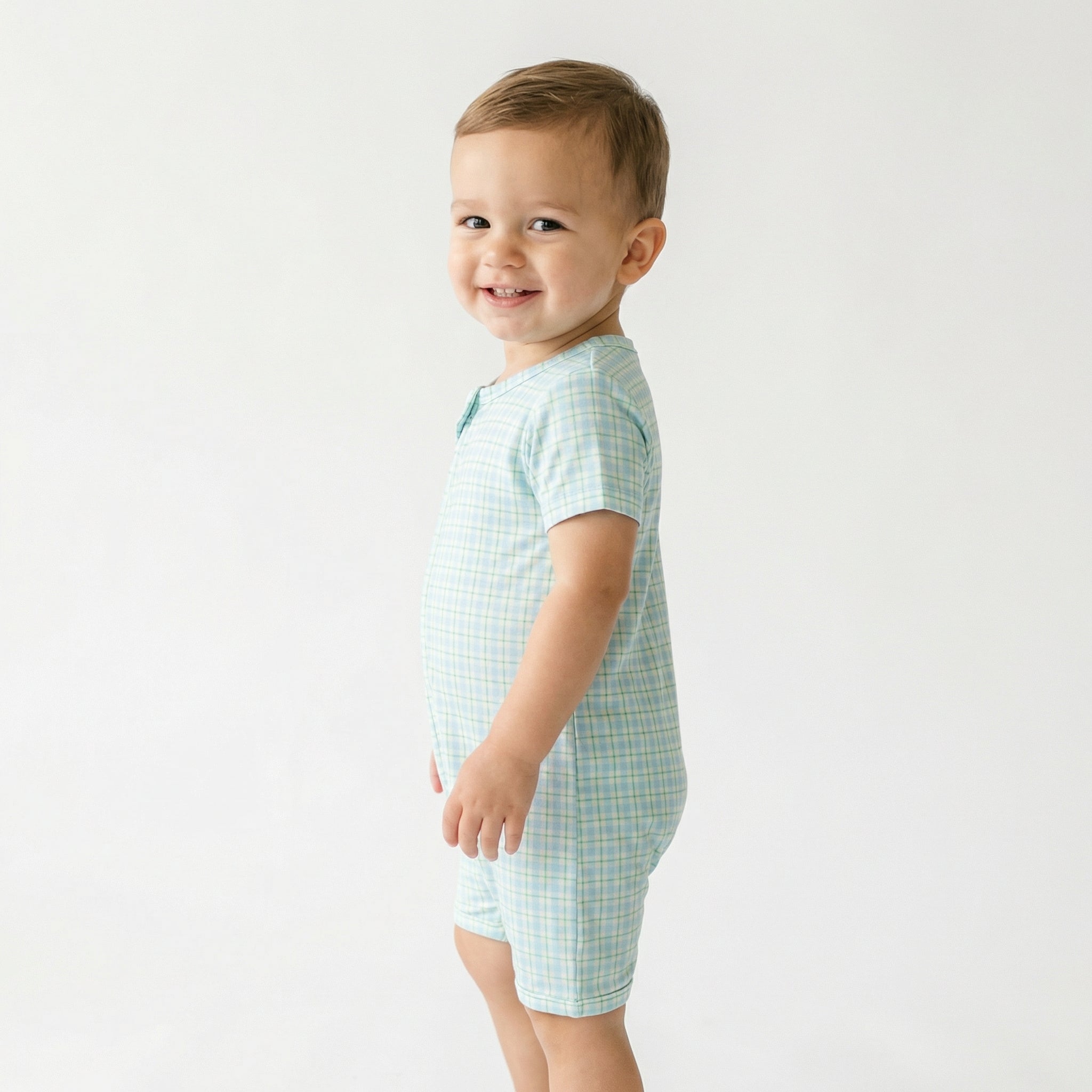 Editor favorite Motette organic bamboo baby sleeper in blue and green gingham designed for everyday comfort
