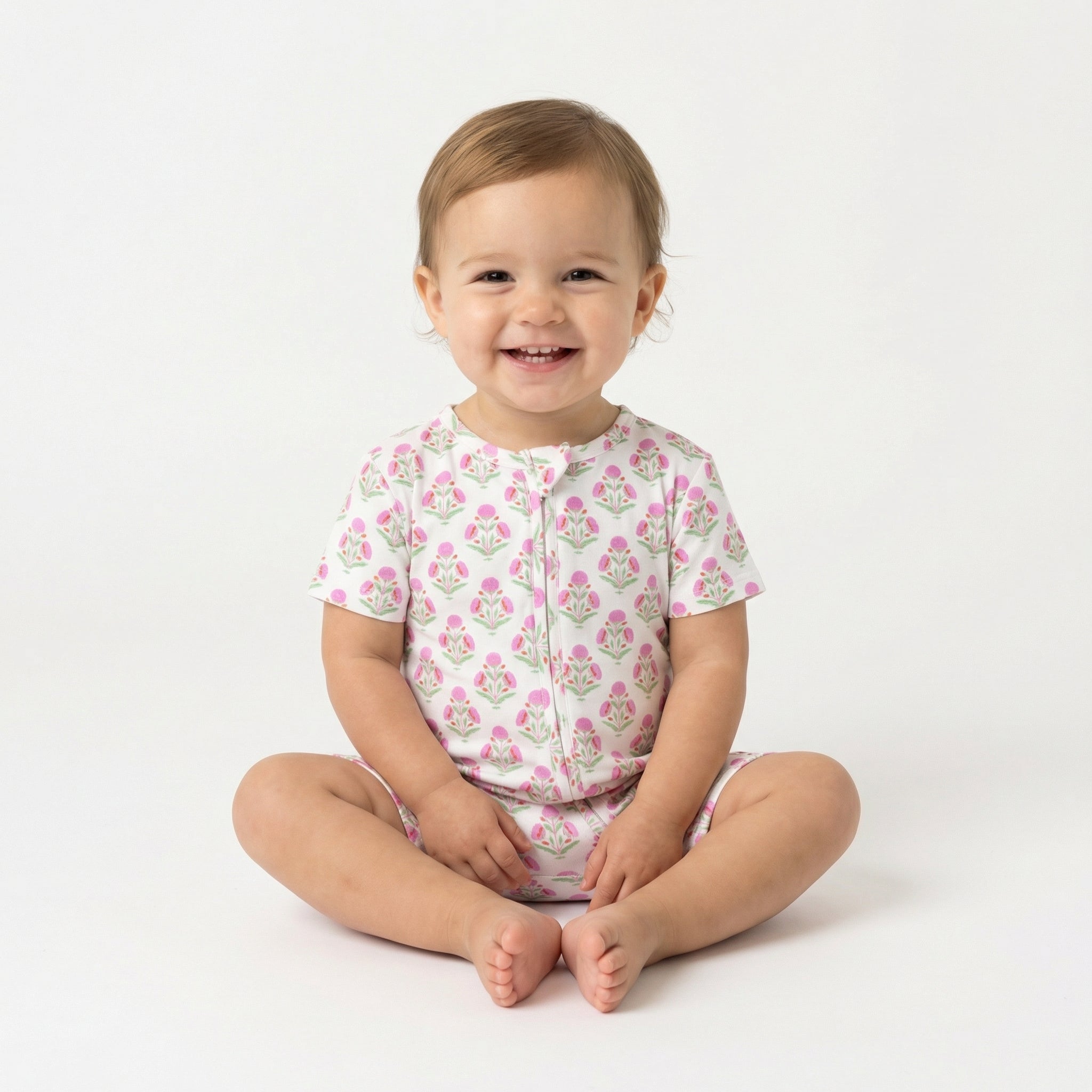 Editor favorite Motette organic bamboo baby sleeper in pink floral designed for everyday comfort