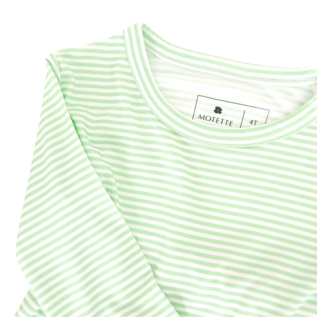 Close-up of the green striped toddler pajama showcasing the soft bamboo fabric.