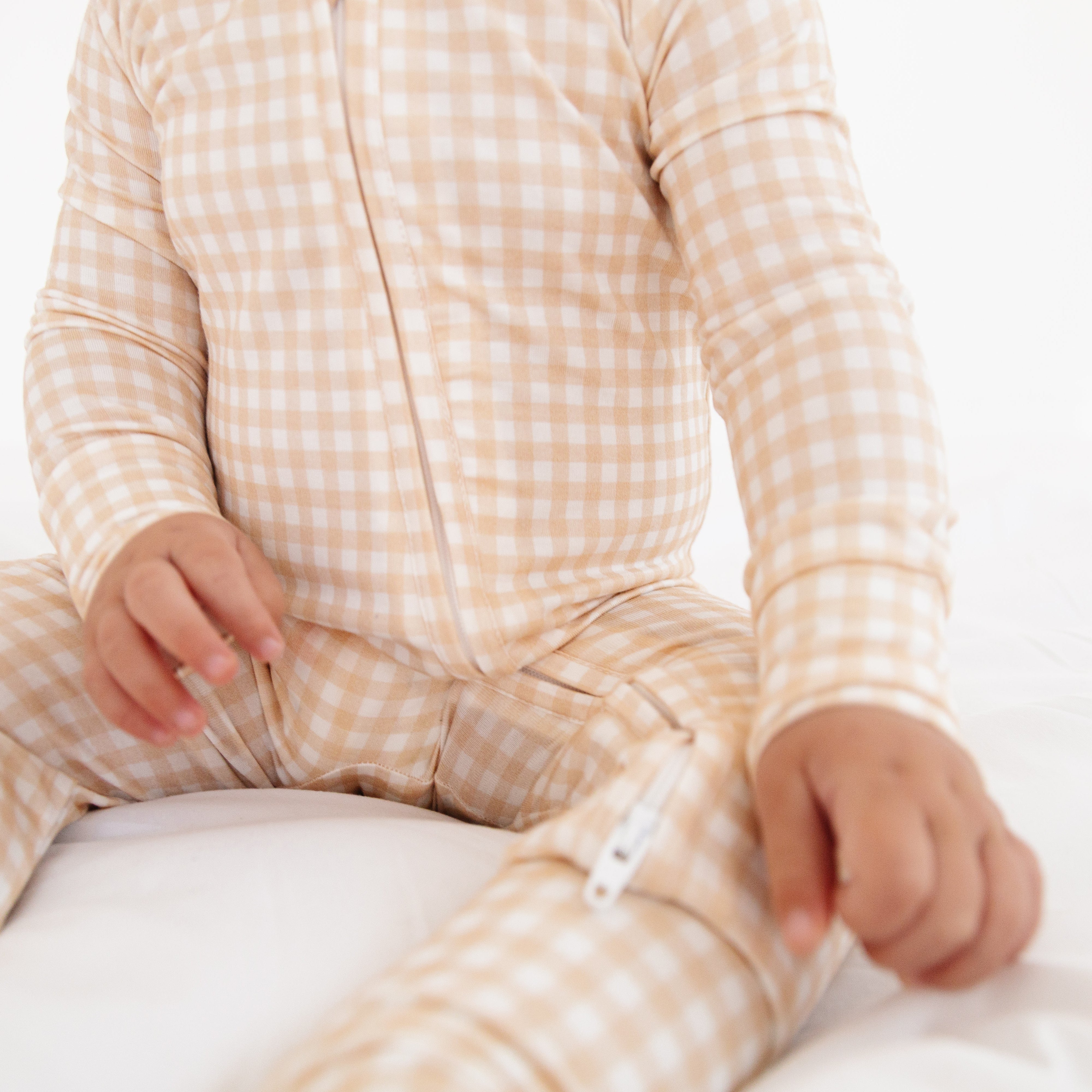Close-up of beige checkered bamboo sleeper, showing functional details