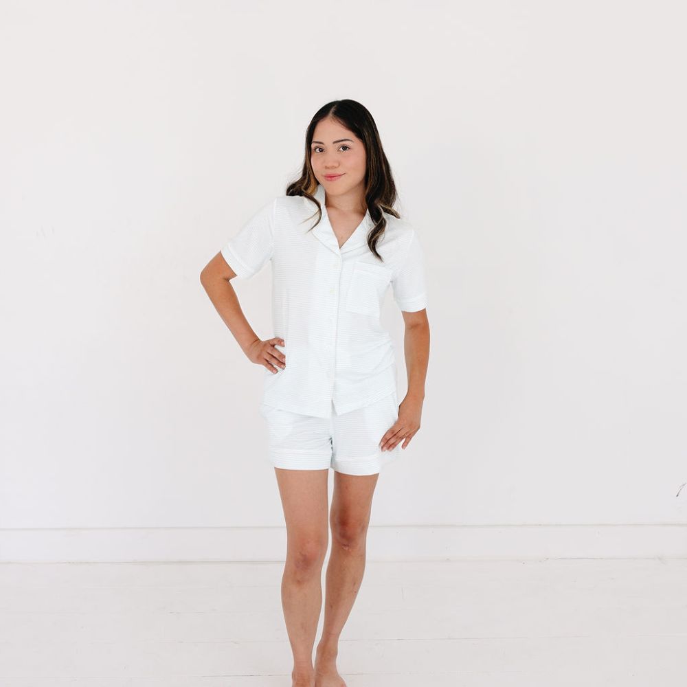 Woman standing in front view wearing Cloud Stripe short sleeve bamboo pajama set – top-ranked bamboo pajamas by Motette, eczema friendly