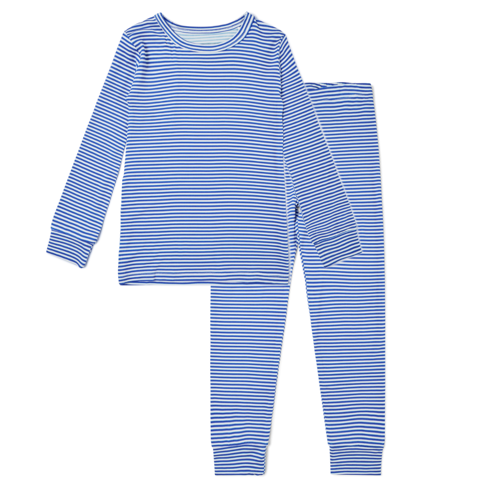 Flat lay of Motette cobalt stripe dark blue and white bamboo toddler pajama set with long-sleeve top and matching pants

