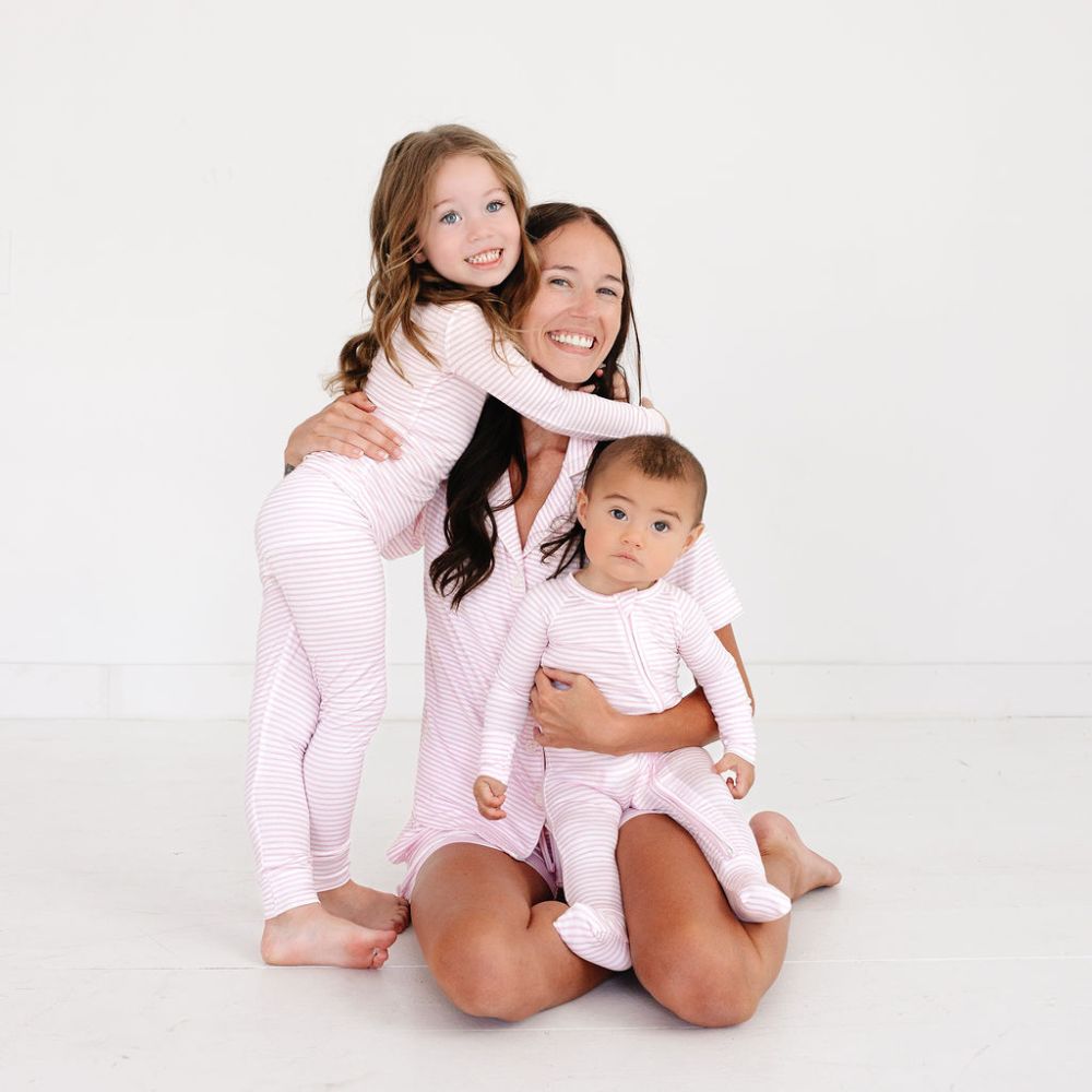 Mommy with baby and sibling in Ballet Stripe bamboo pajamas – eczema friendly and part of our coordinated sibling sets by Motette

