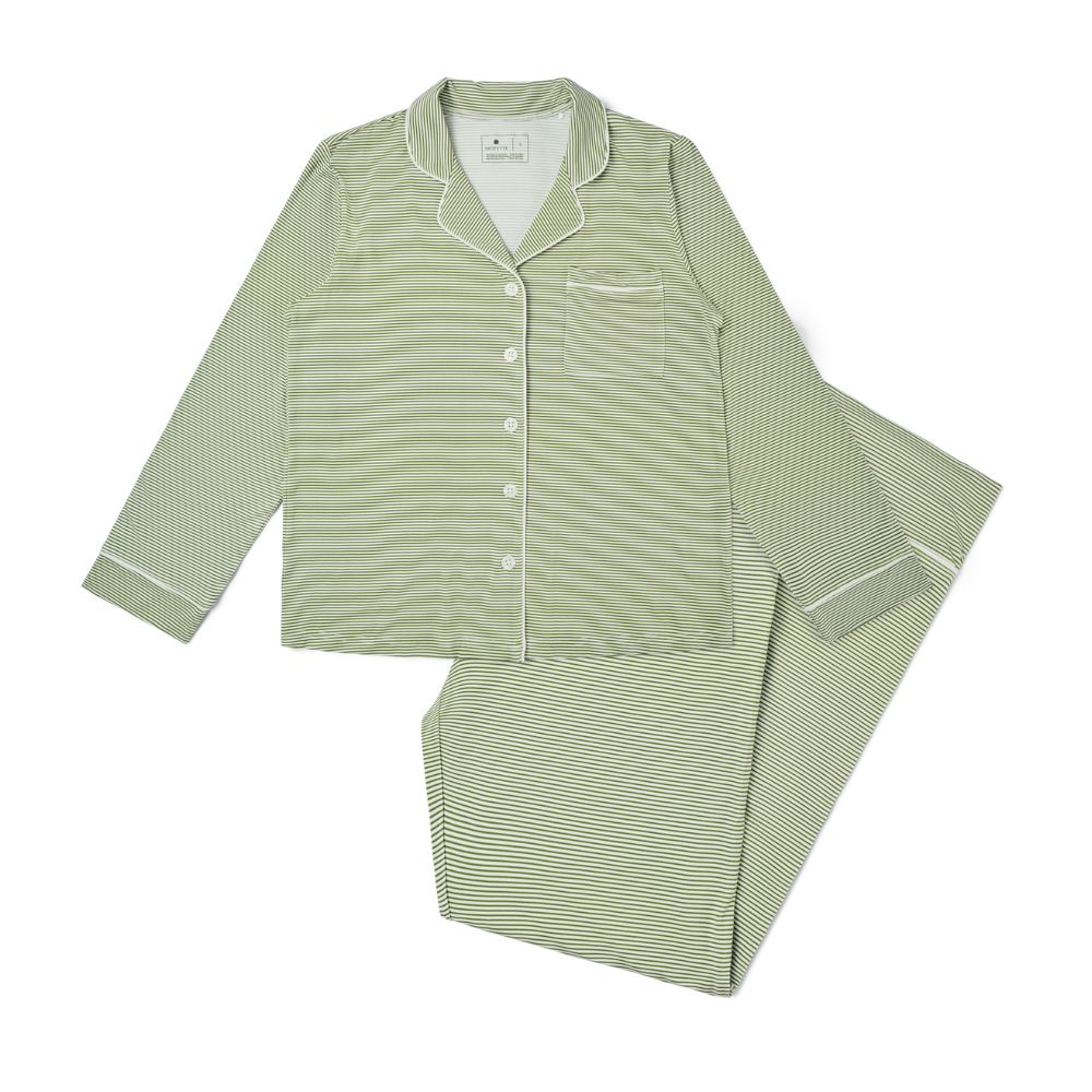 Motette Evergreen Stripe Long Sleeve and Pants Bamboo Women's Pajama Set laid flat, featuring a soft green and white striped pattern, button-up top with pocket, and matching full-length pants with white piping.