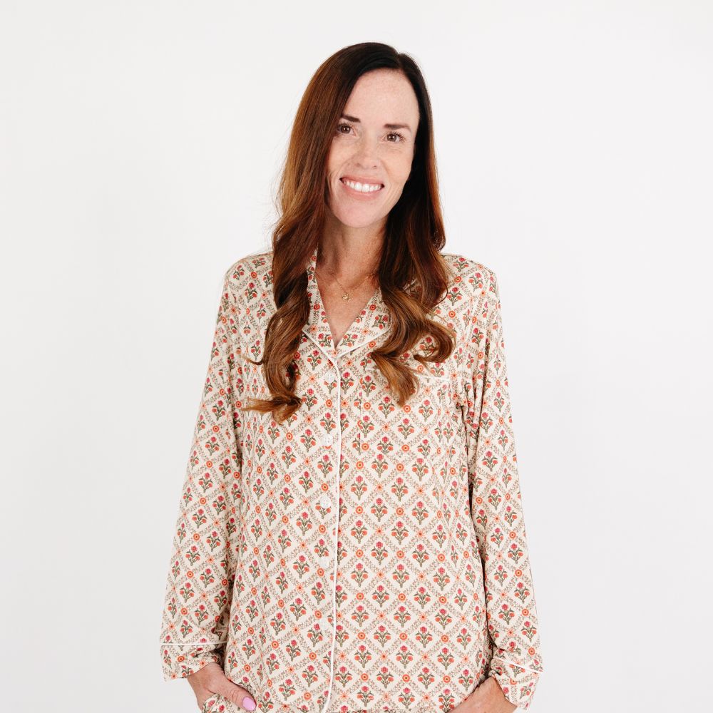 Mommy wearing the Motette Holly Trellis Bamboo Women's Pajama Top, featuring a cream background with red and green floral trellis print and white piping detail.