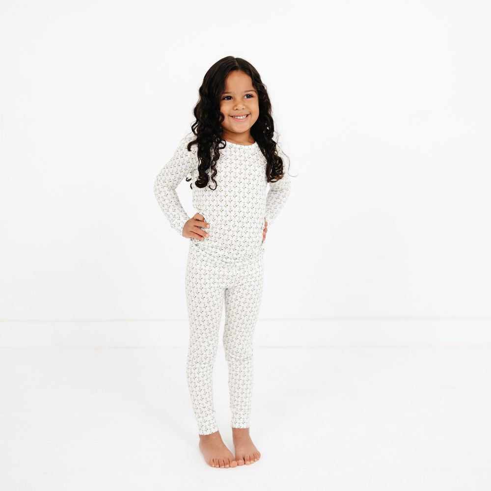 Young girl standing confidently with hands on hips wearing Motette Lavender Lane Bamboo Kids Pajama Set.