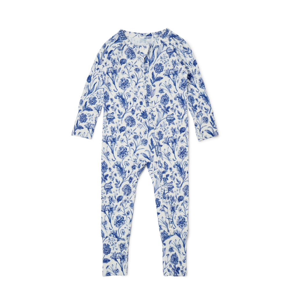 Flat lay of Motette porcelain vine floral long sleeve bamboo baby sleeper with zipper

