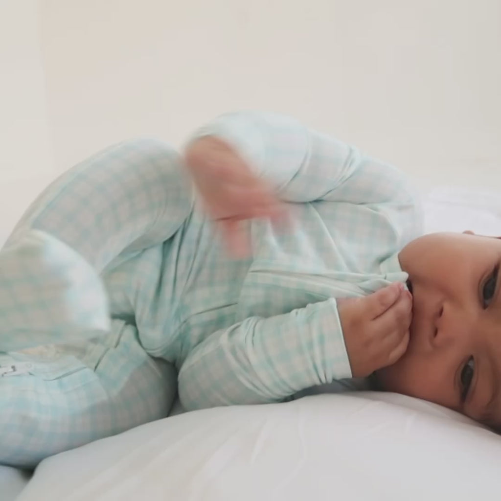 video of baby in bamboo blue checkered sleeper